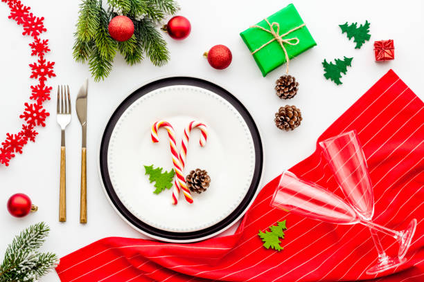istock Top view of Christmas table place setting with empty plate and festive decorations 1287865228