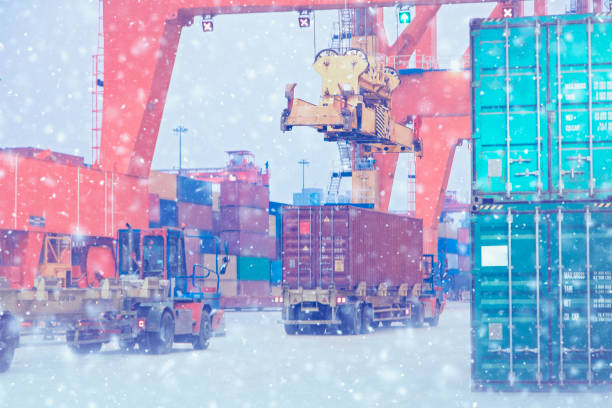 istock Cargo ship being loaded at commercial port in winter. 1287865492