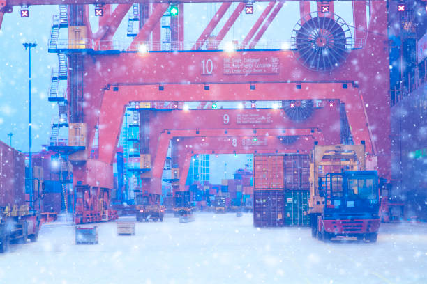 istock Cargo ship being loaded at commercial port in winter. 1287866154