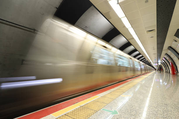 istock Motin Blured Metro Moving in a Station 1287866333