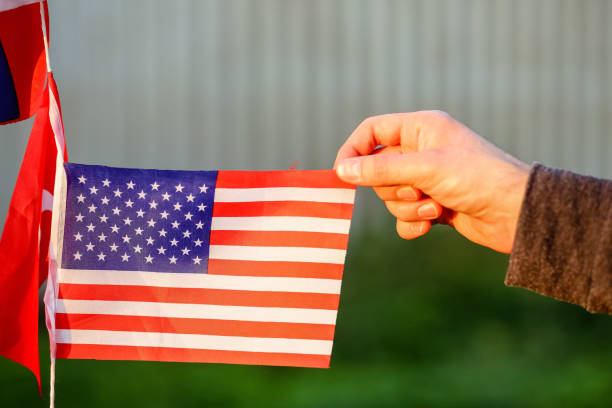 istock American flag in hand 1287867437