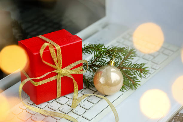 istock gift box on the computer.Christmas shopping 1287867537