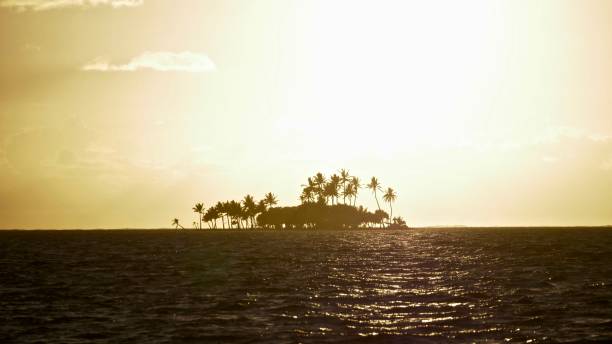 Hot sunrise The hot season at the sunrise of the wallis lagoon it’s a voluntary over exposed picture to show how hot it’s already a 5 am during September to December wallis and futuna islands stock pictures, royalty-free photos & images