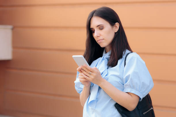 istock Business Woman Reading Important Notifications on Smartphone 1287868650