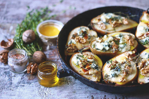 istock Baked pears with dorblu cheese and herbs. 1287870056