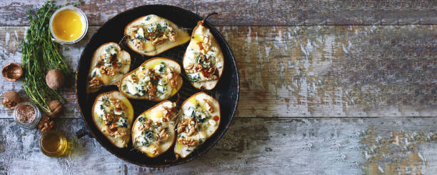 istock Baked pears with dorblu cheese and herbs. 1287870060