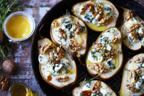 istock Baked pears with dorblu cheese and herbs. 1287870071