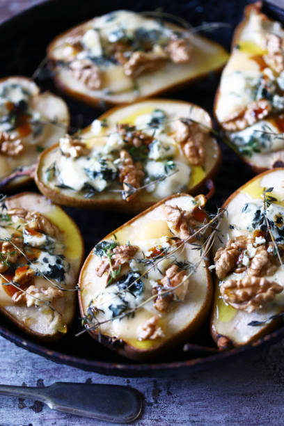 istock Baked pears with dorblu cheese and herbs. 1287870101