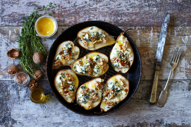 istock Baked pears with dorblu cheese and herbs. 1287870103