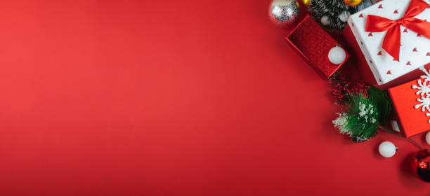 istock Top view new year and christmas composition on red background, banner with copy space 1287870259