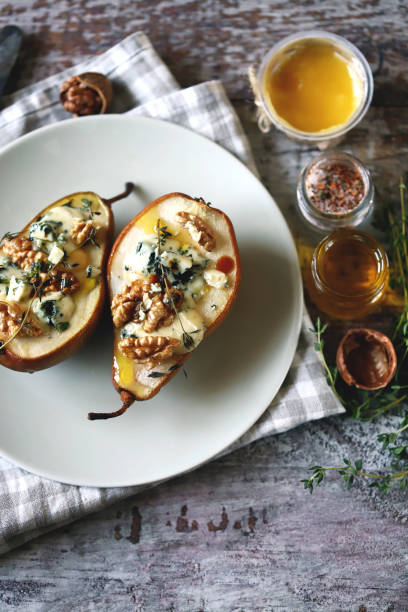 istock Baked pears with dor blue cheese on a plate. 1287870889