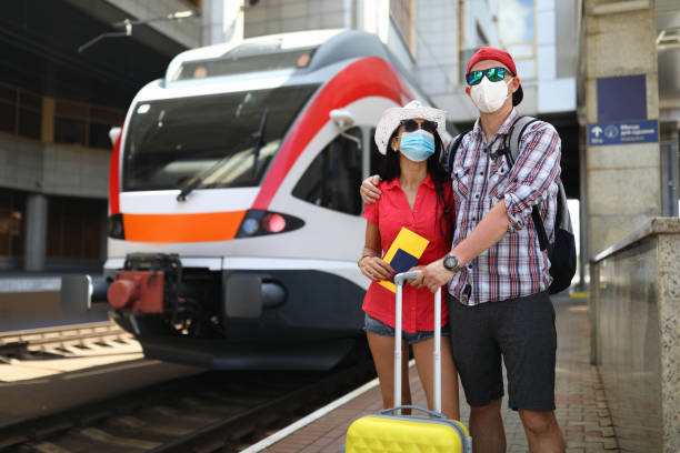 istock Family stands next to a train waiting for boarding 1287872681