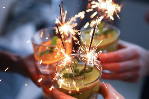 istock People hold glasses with fruit cocktails close-up 1287872704