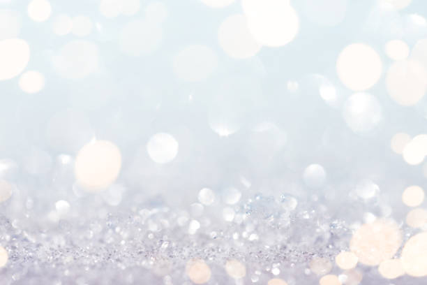 istock Abstract snow and glitter background with gold lights 1287874696