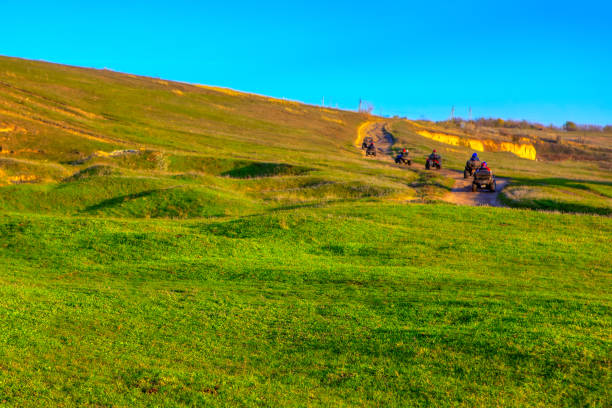 istock quad bikes riding on the hills 1287878196