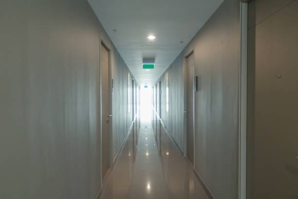 istock Empty condo, hotel or apartment corridor hall way in condominium building, modern interior design decoration room. Walkway 1287878706