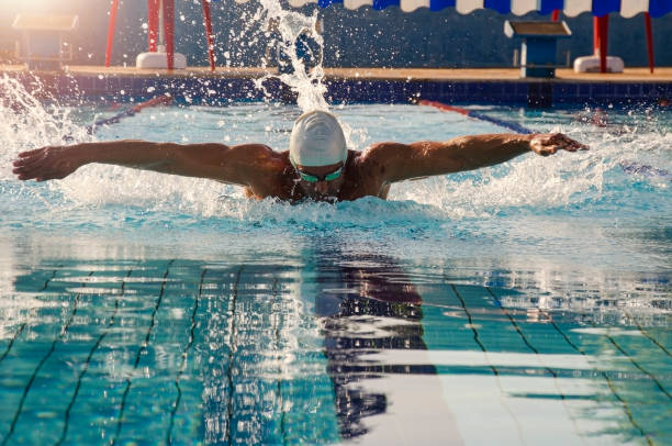 istock Man swimming in a swimming pool. 1287883268