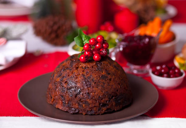 istock Traditional Christmas pudding with holly on top. 1287884281