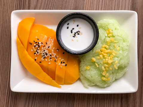 Thai traditional dessert. Glutinous rice with mango and coconut milk