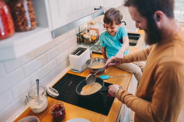 istock Father and son making pancakes at home 1287885191