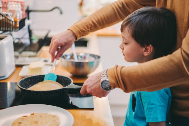 istock Family at home cooking during COVID-19 lockdown 1287886487
