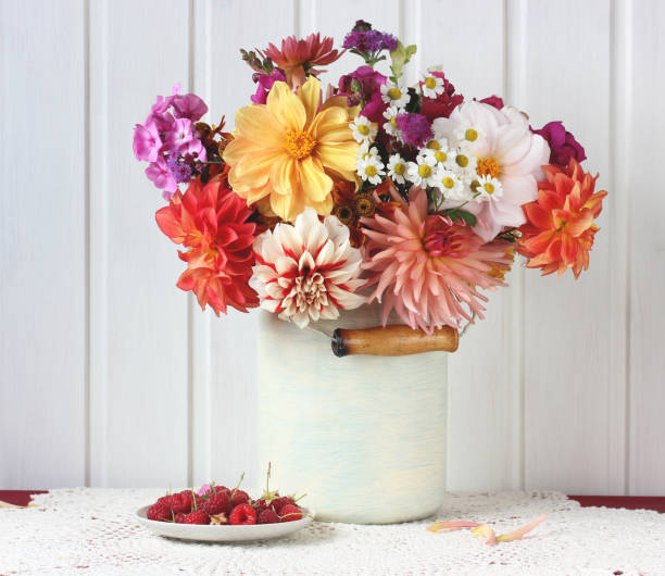 istock dahlias and raspberries. flowers and berries. 1287886849