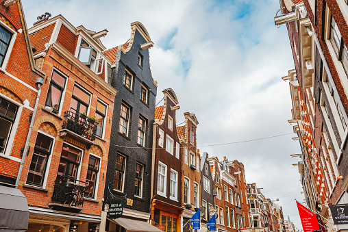 August 1st, 2020 – Amsterdam, Netherlands: Beautiful Architecture in Amsterdam, Netherlands like in this beautiful street called Nieuwe Spiegelstraat in the city center on a sunny day in August 2020
