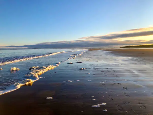 Dornoch beach is a beautiful expanse of golden sand located on the tranquil Dornoch Firth
