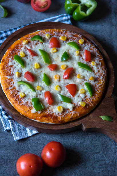 istock Close up of pizza with tomatoes and mozzarella 1287894221