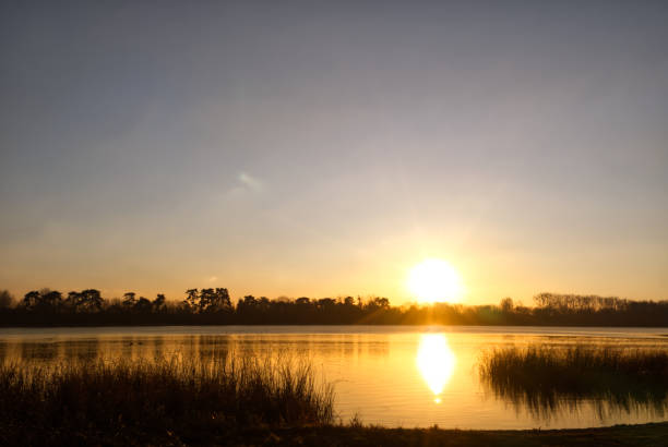 istock Pond of Saint-Quentin and shore view at sunset 1287895537