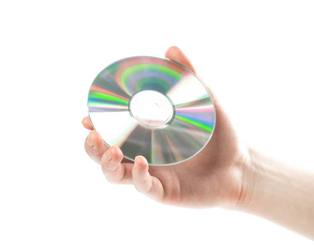 istock Hand holding a CD. Close up. Isolated on a white background 1287897825