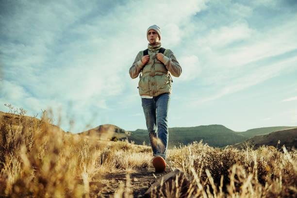 istock Young active teen walking through mountain trail spending alone time getting fresh air 1287899930
