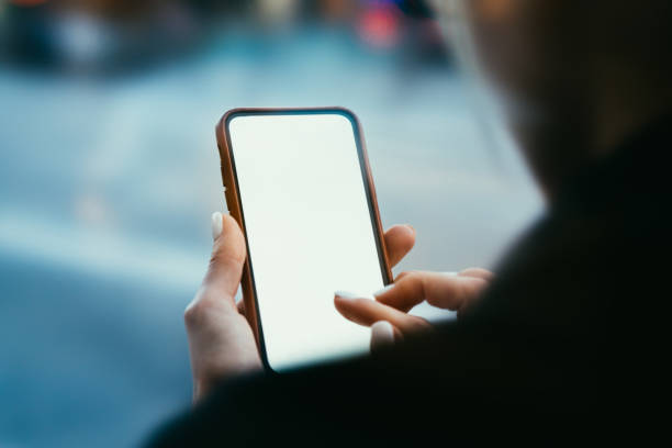 istock Crop faceless female student surfing internet on smartphone in street 1287901357