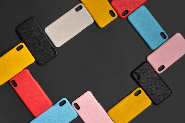 istock Set of colorful protective smartphone cases or covers on black studio background. Close up, copy space. Top view, flat lay, mock up 1287904465