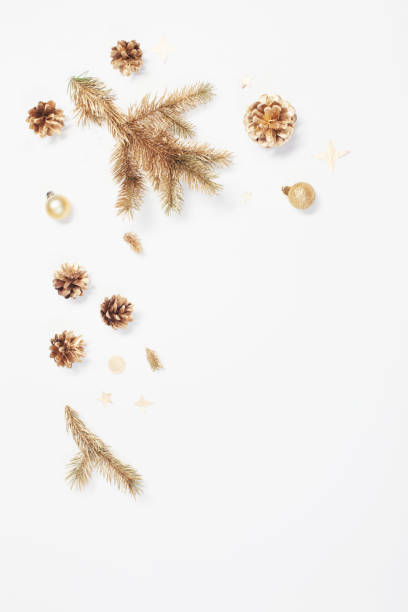 istock golden Christmas decorations on white background 1287906512