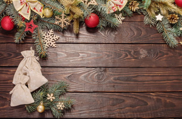 istock fir branches with Christmas decor on old dark wooden background 1287906533