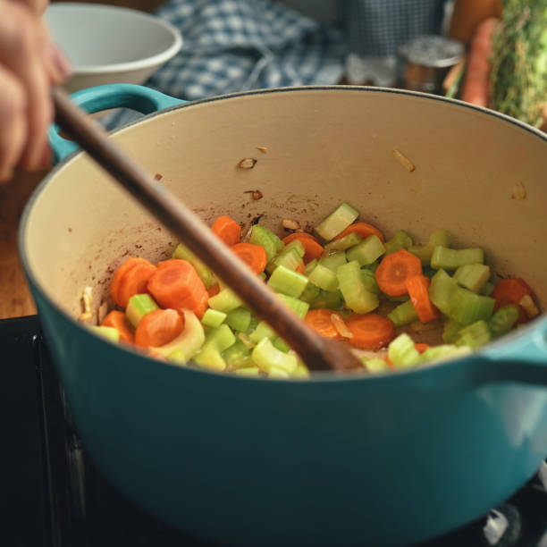istock Preparing Chicken Noodles Soup with Fresh Vegetables 1287906649