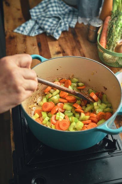 istock Preparing Chicken Noodles Soup with Fresh Vegetables 1287906747