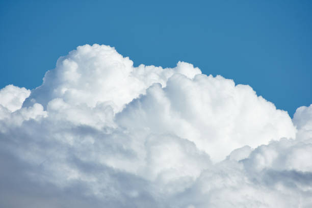 istock Detail of large clouds over a blue sky 1287908918