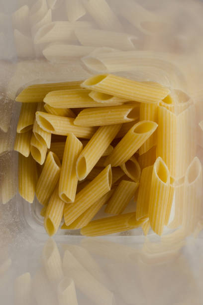 istock Close up of penne noodles 1287910544
