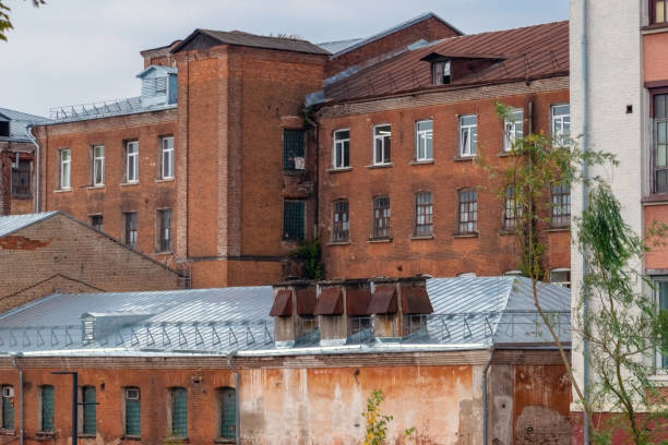 istock Facades of old red brick buildings 1287912355