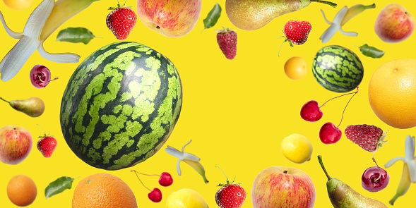 Flying fruits and berries on a yellow background with place for text. Bright poster, poster.
