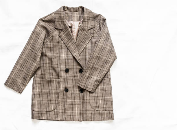 istock Women's plaid blazer on a light background, top view 1287914332