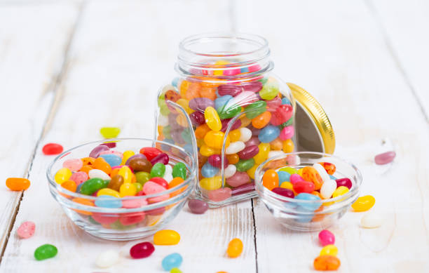 Jelly beans in the glass bowl and jar