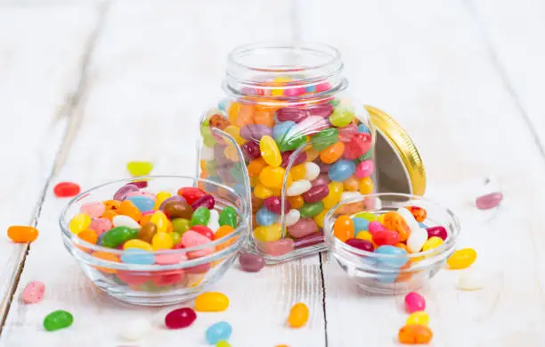 Photo of Jelly beans in the glass bowl and jar