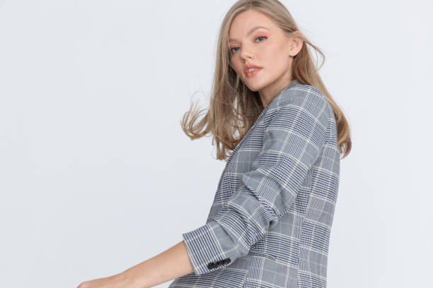 istock side view of young girl in checkered suit posing 1287915561