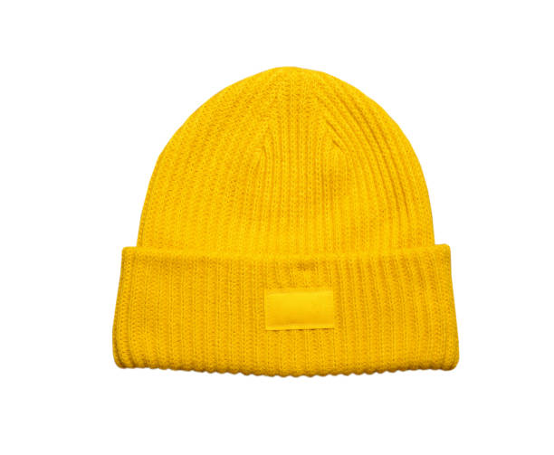 istock yellow winter hat isolated on white background, winter cap isolated 1287919081