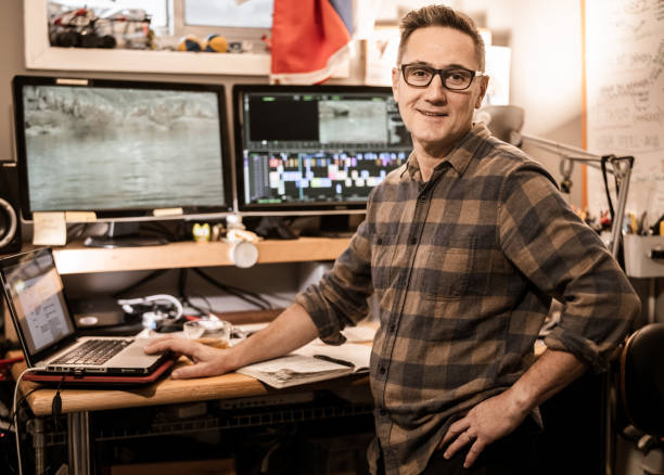 istock Male video editor working at home 1287925946