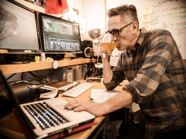 istock Male video editor working at home 1287926962