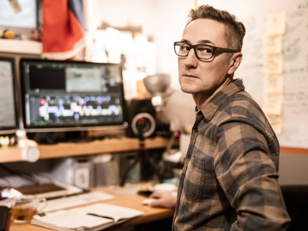 istock Male video editor working at home 1287927091